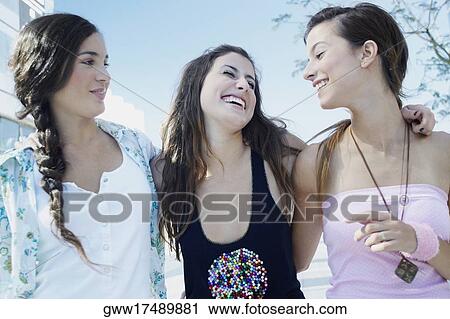 Close-up of three young women smiling View Large Photo Image Stock Image - Close-up of three young women smiling. Fotosearch