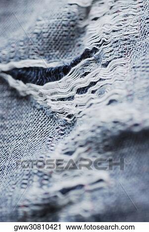 Close-up of torn denim View Large Photo Image Stock Image - Close-up of torn denim. Fotosearch
