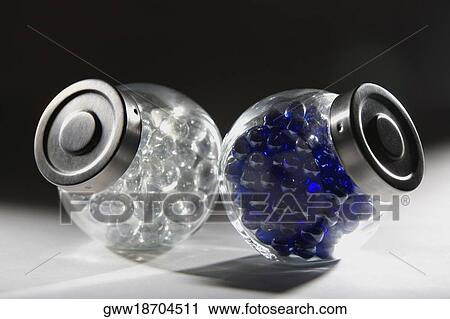 Close-up of two bottles of marbles View Large Photo Image Stock Image - Close-up of two bottles of marbles. Fotosearch