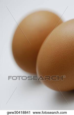 Close-up of two brown eggs View Large Photo Image Stock Image - Close-up of two brown eggs. Fotosearch