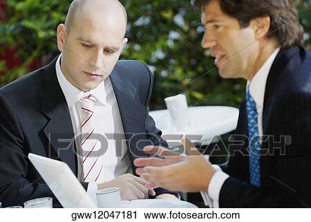 Close-up of two businessmen View Large Photo Image Stock Image - Close-up of two businessmen. Fotosearch