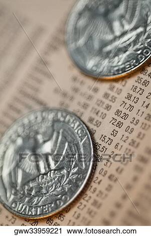 Close-up of two coins on a financial report View Large Photo Image Stock Image - Close-up of two coins on a financial report. Fotosearch