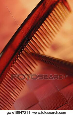 Stock Image - Close-up of two combs. Fotosearch
