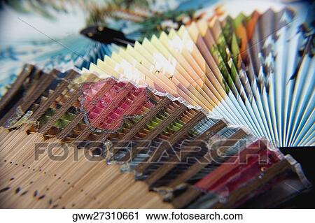 Stock Image - Close-up of two folding fans. Fotosearch