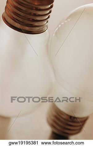 Stock Image - Close-up of two light bulbs. Fotosearch