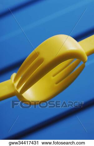 Stock Image - Close-up of two plastic forks. Fotosearch