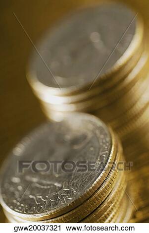 Close-up of two stacks of coins View Large Photo Image Stock Image - Close-up of two stacks of coins. Fotosearch