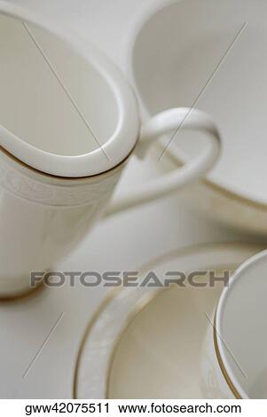 Close-up of two tea cups and a saucer with a bowl View Large Photo Image Stock Image - Close-up of two tea cups and a saucer with a bowl. Fotosearch