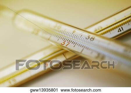 Stock Image - Close-up of two thermometers. Fotosearch