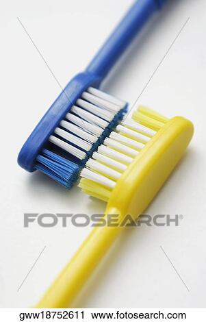 Close-up of two toothbrushes View Large Photo Image Stock Image - Close-up of two toothbrushes. Fotosearch