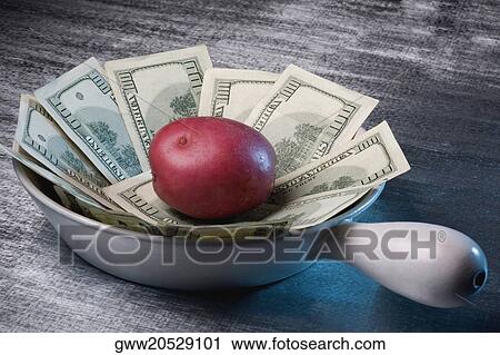 Currency notes and a raw potato in a frying pan View Large Photo Image Stock Image - Currency notes and a raw potato in a frying pan. Fotosearch