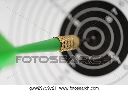 Dart in the bull's eye of a dart board View Large Photo Image Stock Image - Dart in the bull's eye of a dart board. Fotosearch