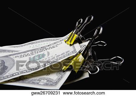 Dollar bills in binder clips View Large Photo Image Stock Image - Dollar bills in binder clips. Fotosearch