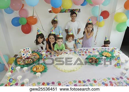 Group of children at a birthday party View Large Photo Image Stock Image - Group of children at a birthday party. Fotosearch