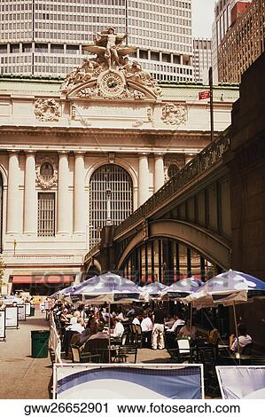 Stock Image - Group of people at a sidewalk cafe. Fotosearch
