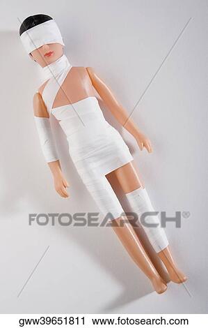 High angle view of a doll wrapped in bandage View Large Photo Image Stock Image - High angle view of a doll wrapped in bandage. Fotosearch