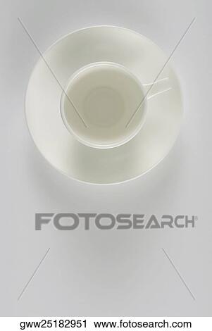 High angle view of a tea cup on a saucer View Large Photo Image Stock Image - High angle view of a tea cup on a saucer. Fotosearch