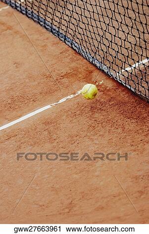High angle view of a tennis ball near a tennis net View Large Photo Image Stock Image - High angle view of a tennis ball near a tennis net. Fotosearch