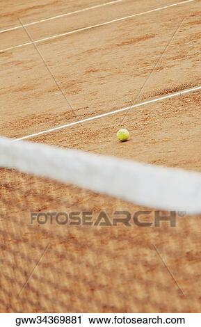 Stock Image - High angle view of a tennis net on a tennis court. Fotosearch