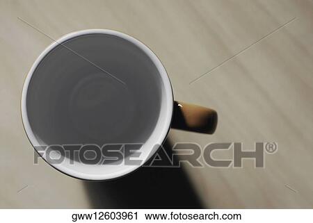 Stock Image - High angle view of an empty coffee cup. Fotosearch