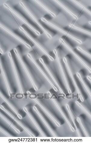 Stock Image - High angle view of cotton swabs. Fotosearch