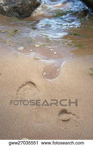 High angle view of footprint of a person in sand View Large Photo Image Stock Image - High angle view of footprint of a person in sand. Fotosearch