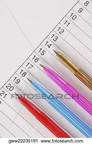 High angle view of four pens on a sheet of paper View Large Photo Image Stock Image - High angle view of four pens on a sheet of paper. Fotosearch