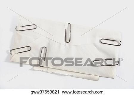 High angle view of paper clips on an envelope View Large Photo Image Stock Image - High angle view of paper clips on an envelope. Fotosearch