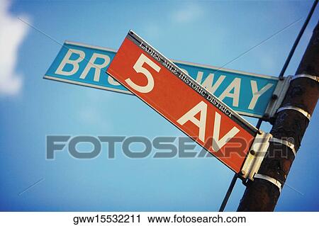 Stock Image - Low angle view of an information board, Manhattan, New York City, New York State, USA. Fotosearch