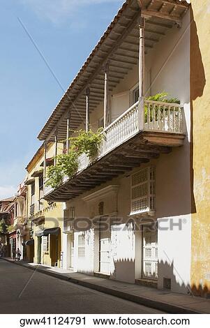 Low angle view of houses along the street View Large Photo Image Stock Image - Low angle view of houses along the street. Fotosearch