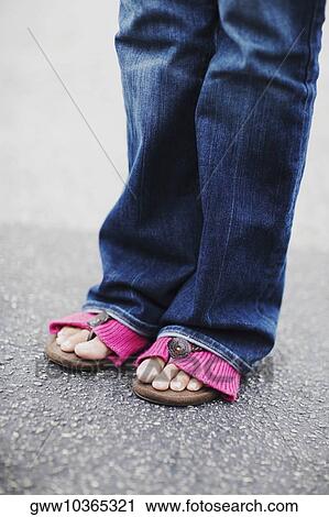 Low section view of a person standing View Large Photo Image Stock Image - Low section view of a person standing. Fotosearch
