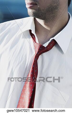 Mid section view of a businessman View Large Photo Image Stock Image - Mid section view of a businessman. Fotosearch