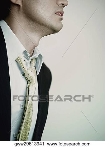 Mid section view of a businessman View Large Photo Image Stock Image - Mid section view of a businessman. Fotosearch