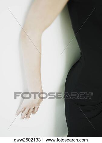 Mid section view of a woman View Large Photo Image Stock Image - Mid section view of a woman. Fotosearch