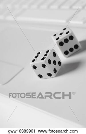 Pair of dice on a laptop View Large Photo Image Stock Image - Pair of dice on a laptop. Fotosearch