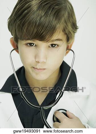 Portrait of a boy dressed as a doctor View Large Photo Image Stock Image - Portrait of a boy dressed as a doctor. Fotosearch