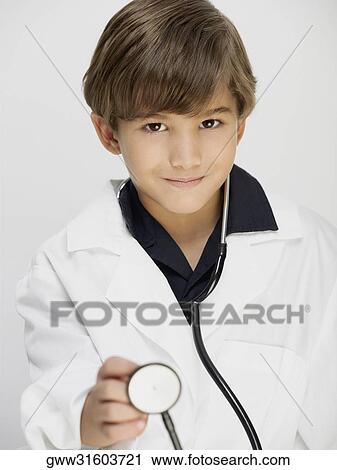 Stock Image - Portrait of a boy dressed as a doctor. Fotosearch