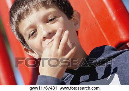 Portrait of a boy eating View Large Photo Image Stock Image - Portrait of a boy eating. Fotosearch