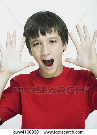 Portrait of a boy gesturing with his hands View Large Photo Image Stock Image - Portrait of a boy gesturing with his hands. Fotosearch