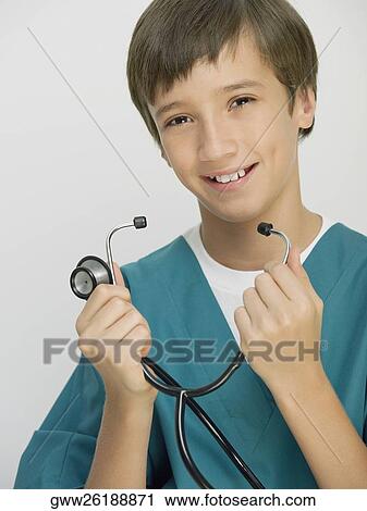 Portrait of a boy holding a stethoscope View Large Photo Image Stock Image - Portrait of a boy holding a stethoscope. Fotosearch