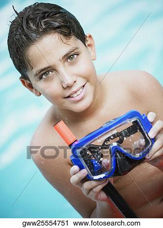 Stock Image - Portrait of a boy holding snorkel. Fotosearch