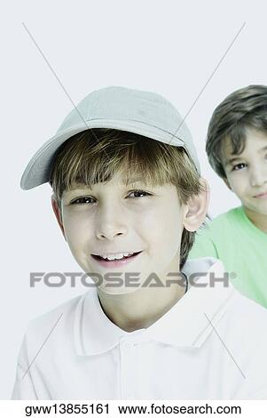 Portrait of a boy smiling with his friend in the background View Large Photo Image Stock Image - Portrait of a boy smiling with his friend in the background. Fotosearch