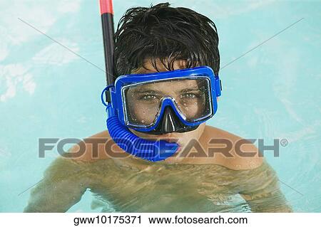 Portrait of a boy snorkeling in a swimming pool View Large Photo Image Stock Image - Portrait of a boy snorkeling in a swimming pool. Fotosearch