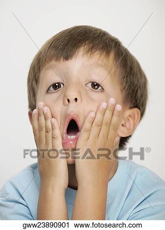 Portrait of a boy stretching his cheeks View Large Photo Image Stock Image - Portrait of a boy stretching his cheeks. Fotosearch