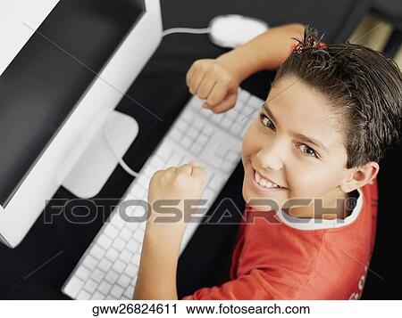 Portrait of a boy with a computer View Large Photo Image Stock Image - Portrait of a boy with a computer. Fotosearch