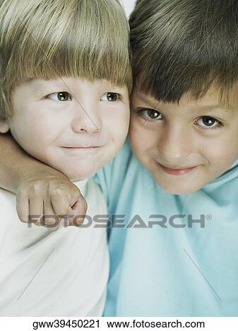 Portrait of a boy with his arm over his brother View Large Photo Image Stock Image - Portrait of a boy with his arm over his brother. Fotosearch