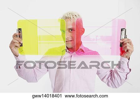 Portrait of a businessman holding two clipboards and smiling View Large Photo Image Stock Image - Portrait of a businessman holding two clipboards and smiling. Fotosearch
