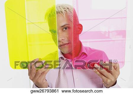 Portrait of a businessman holding two clipboards View Large Photo Image Stock Image - Portrait of a businessman holding two clipboards. Fotosearch
