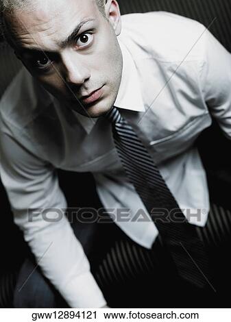Portrait of a businessman looking serious View Large Photo Image Stock Image - Portrait of a businessman looking serious. Fotosearch