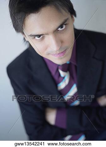 Portrait of a businessman smirking View Large Photo Image Stock Image - Portrait of a businessman smirking. Fotosearch